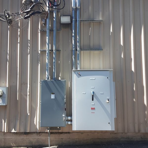 Generator disconnect and panels on a metal building