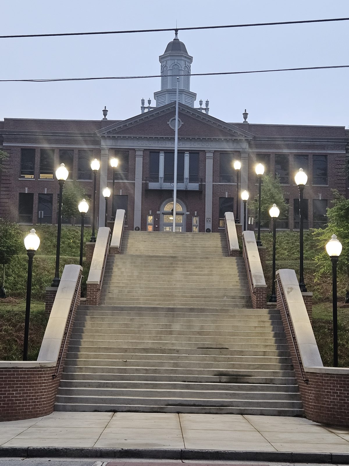 Exterior post lighting at a campus building entrance, installed by Ritch Electric